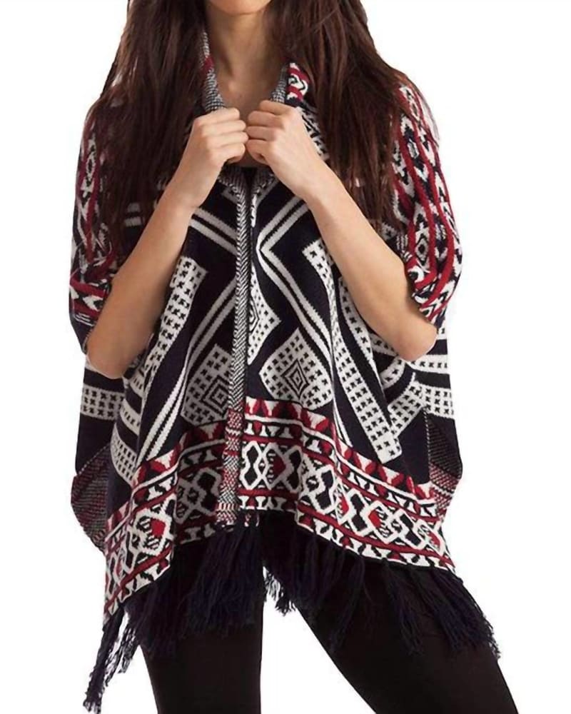 Front of a model wearing a size LG Hannah Tassel Poncho in Black/Red in Black/Red by french kyss. | dia_product_style_image_id:327560